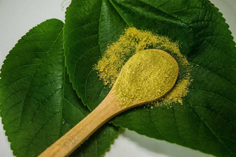 yellow powder on a wooden spoon