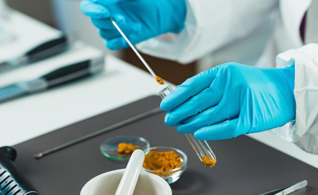 lab worker testing powder material